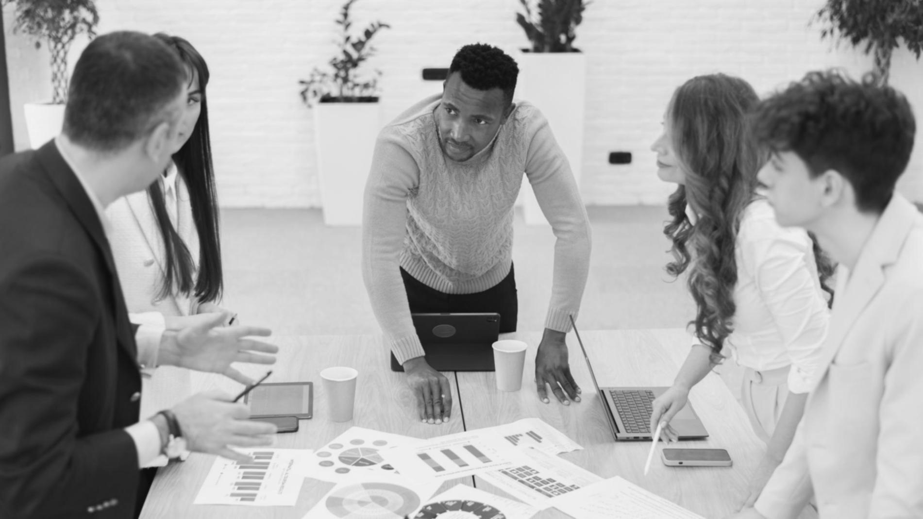 Team reviewing budget performance metrics after implementation